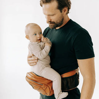 The Tushbaby Hip Carrier Baby & Toddler Tushbaby Color: Vegan Leather Cognac Design: Tushbaby