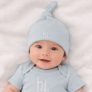 Hi. Embroidered Surf Blue Knotted Baby Hat Huggalugs Size: 0-3 months