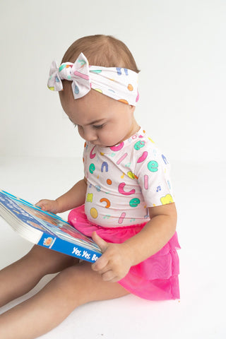 Dream Big Little Co x CoComelon Alphabet Dream Tutu Short Sleeve Bodysuit DressThe Dream Tutu Bodysuit DressDREAM BIG LITTLE COSize: 0-3M