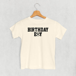 The Birthday Boy Soccer Tee (Kids) POD - Apparel Ivy + Cloth Style: Toddler Tee Color: Natural Size: 2T