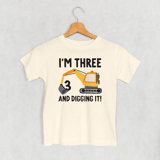 I'm 3 And Digging It Tee (Kids) POD - Apparel Ivy + Cloth Style: Toddler Tee Color: Natural Size: 2T