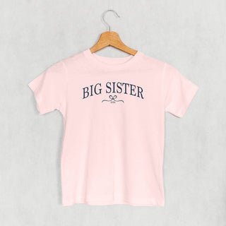 Big Sister 2026 Bow Tee (Kids) POD - Apparel Ivy + Cloth Style: Toddler Tee Color: Pink Size: 2T