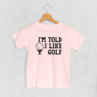 I'm Told I Like Golf Tee (Kids) POD - Apparel Ivy + Cloth Style: Toddler Tee Color: Pink Size: 2T