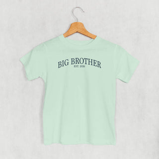 Big Brother Est 2026 Tee (Kids) POD - Apparel Ivy + Cloth Style: Toddler Tee Color: Sage Size: 2T