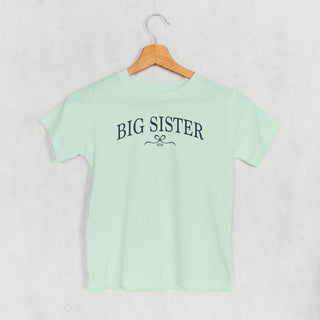 Big Sister 2026 Bow Tee (Kids) POD - Apparel Ivy + Cloth Style: Toddler Tee Color: Sage Size: 2T