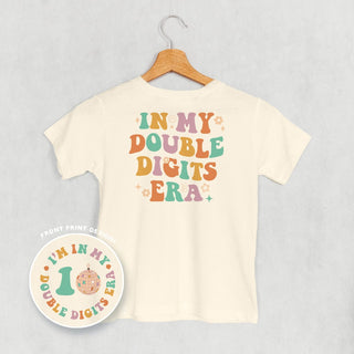In My Double Digits Era Tee (Kids Back Print) POD - Apparel Ivy + Cloth Style: Toddler Tee Color: Natural Size: 2T