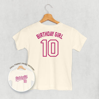 Birthday Girl Varsity #10 Tee (Kids Back Print) POD - Apparel Ivy + Cloth Style: Toddler Tee Color: Natural Size: 2T
