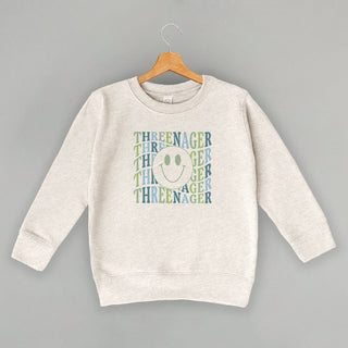 Threenager Tee (Blue + Green) (Kids) POD - Apparel Ivy + Cloth Style: Toddler Crewneck Color: Natural Heather Size: 2T