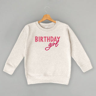 Birthday Girl Tee (Pink Sans Serif + Script) (Kids) POD - Apparel Ivy + Cloth Style: Toddler Crewneck Color: Natural Heather Size: 2T