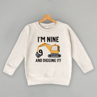 I'm 9 And Digging It Tee (Kids) POD - Apparel Ivy + Cloth Style: Toddler Crewneck Color: Natural Heather Size: 2T