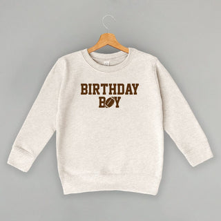 The Birthday Boy Football Tee (Kids) POD - Apparel Ivy + Cloth Style: Toddler Crewneck Color: Natural Heather Size: 2T