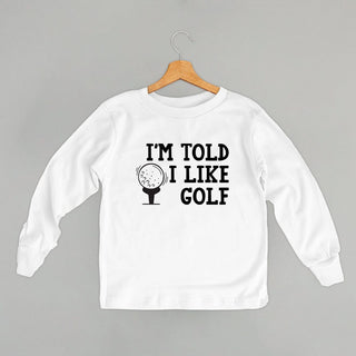 I'm Told I Like Golf Tee (Kids) POD - Apparel Ivy + Cloth Style: Toddler Long Sleeve Color: White Size: 2T