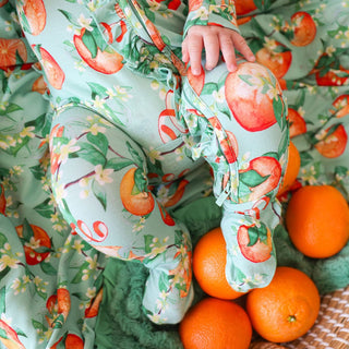 Bamboo Ruffle Footie with 2-Way Zipper - Arancia (Citrus) Baby & Toddler Sleepwear Posh Peanut Size: Newborn