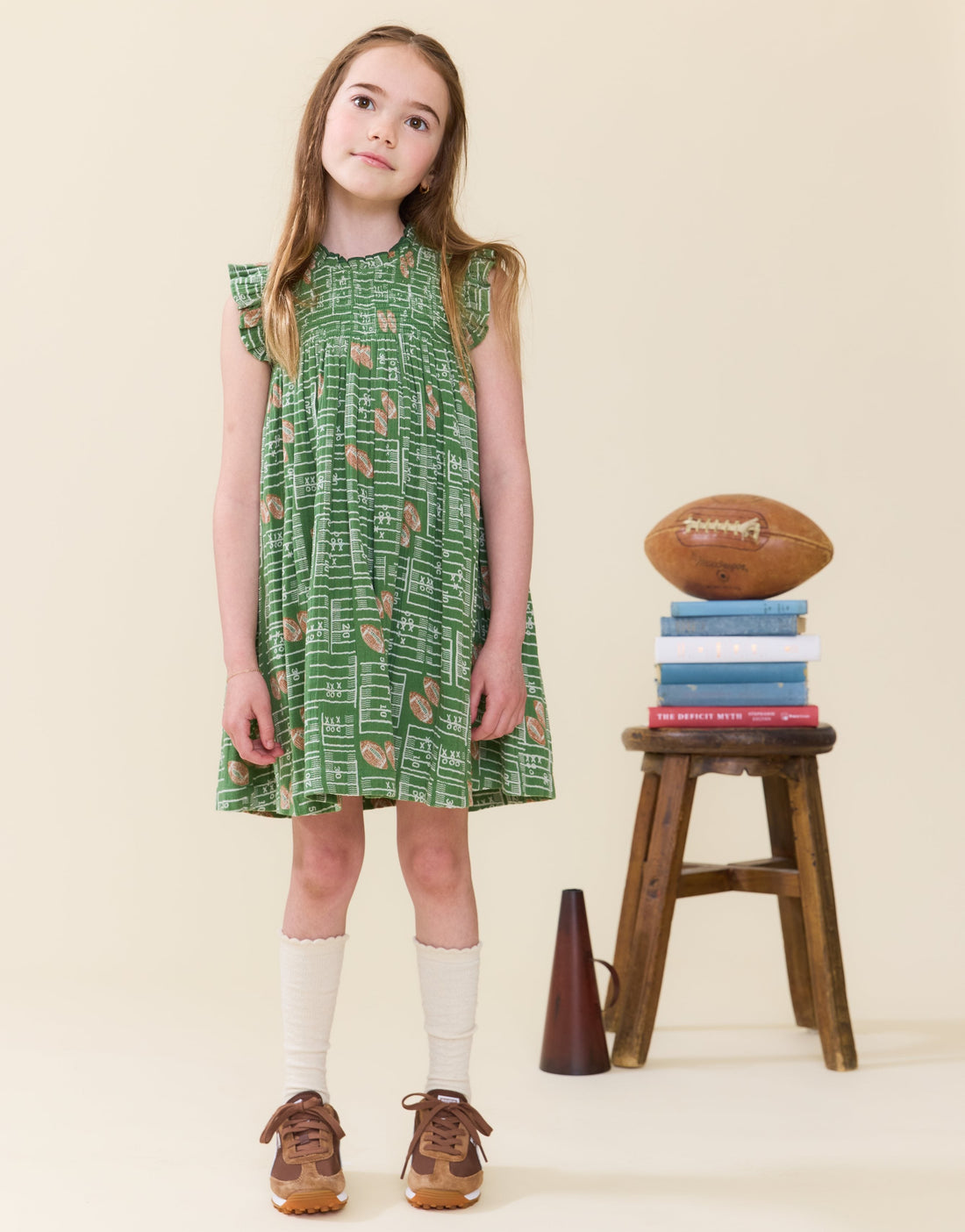 Pink Chicken cotton ruffle sleeve Stevie dress in the Football Field print